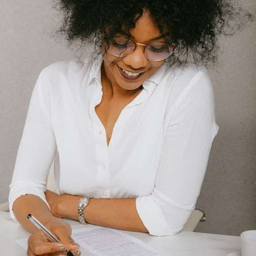 smiling woman filling out a form