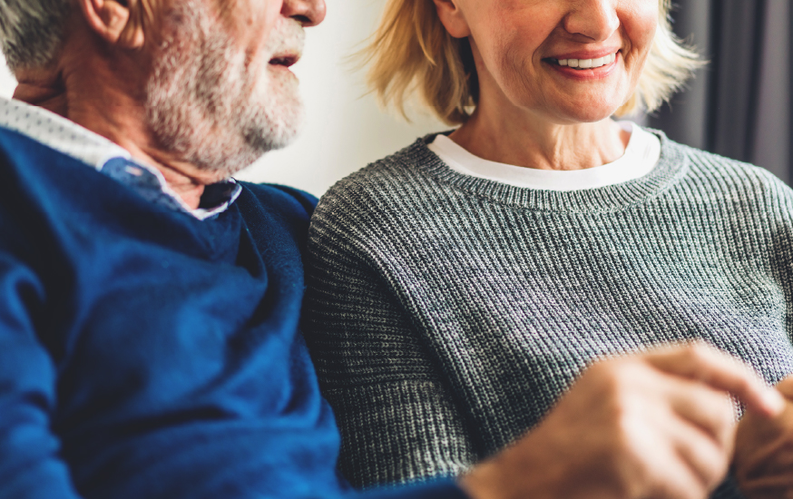 elder couple relaxing in home