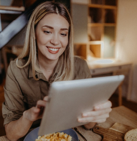 a woman looking at her tablet