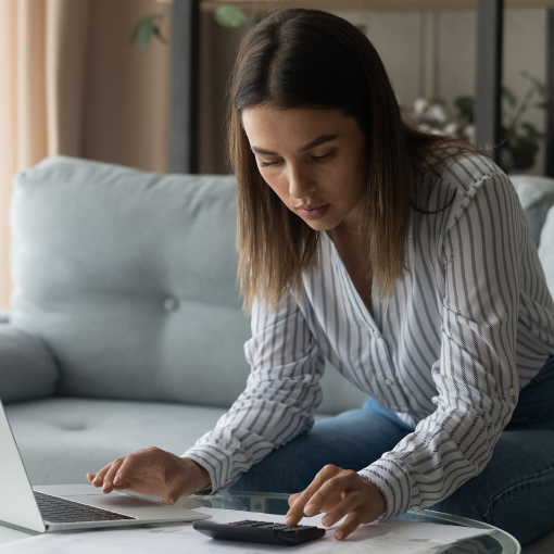 Woman on her laptop making a loan payment