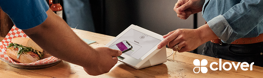 person paying for sandwich with their mobile phone on a clover point-of-sale machine