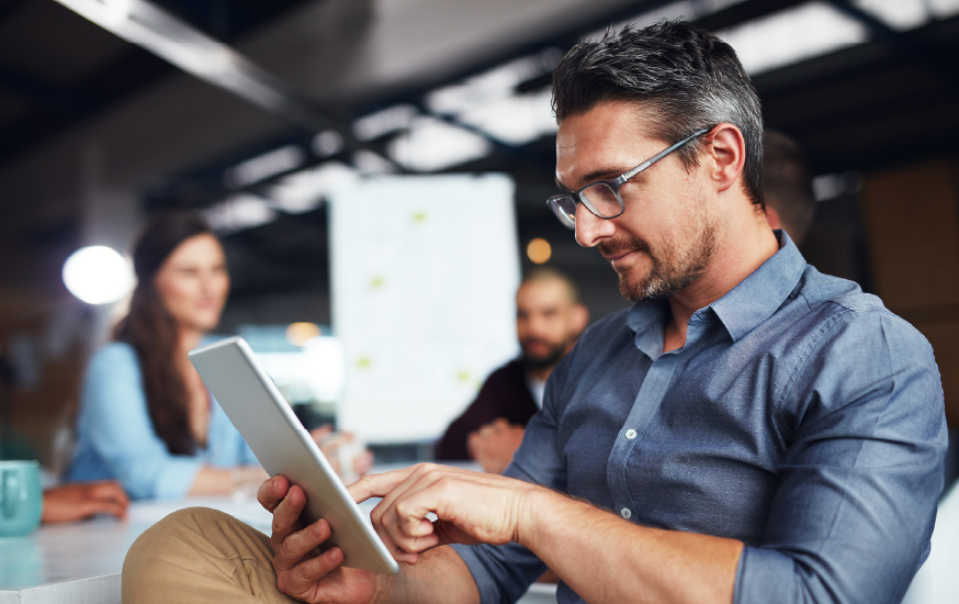 Man in office using tablet