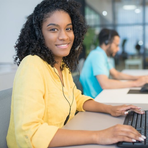 woman wearing an headset working at a desk