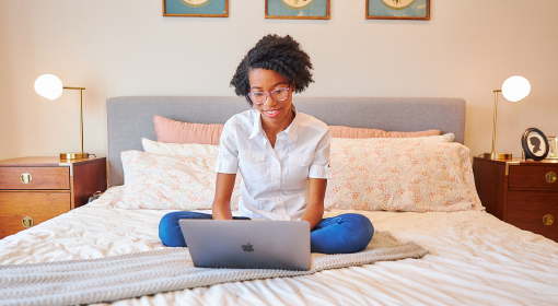 young woman using laptop at home