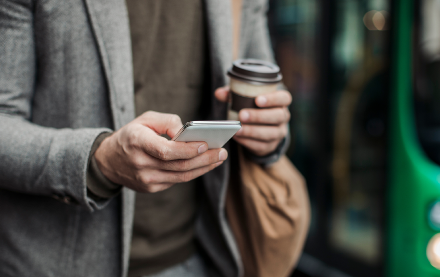 Man using phone on the go