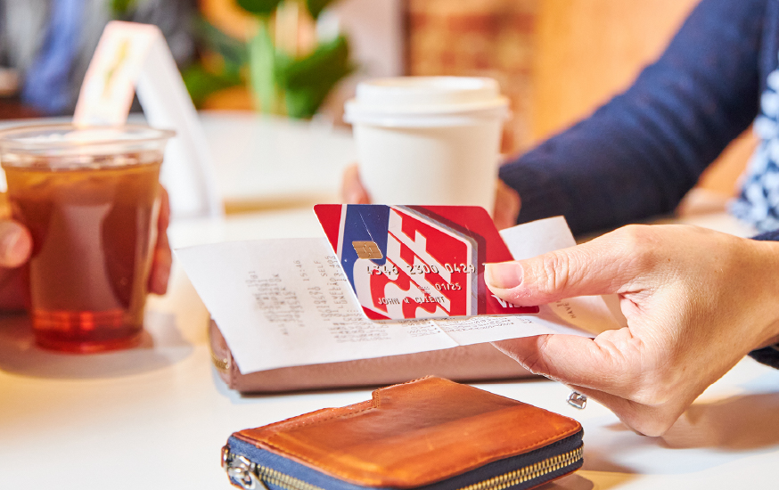 woman paying with debit card