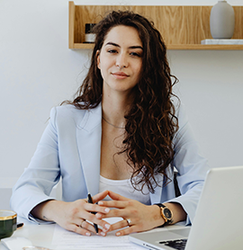 woman in business suit with computer