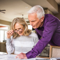 mature couple reviewing documents